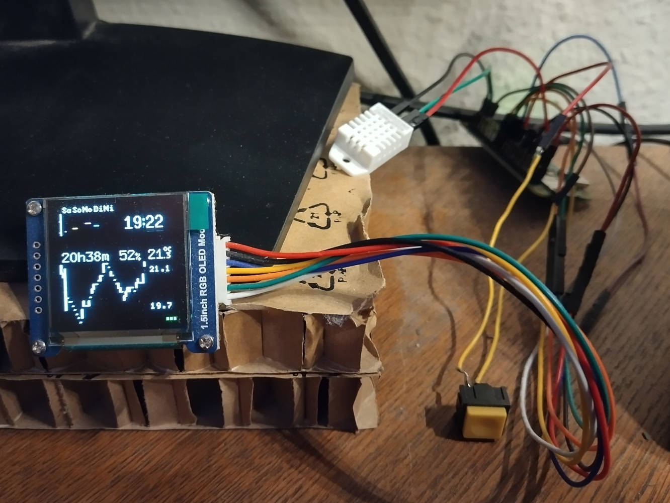 OLED display showing temperature and upcoming appointments, connected to a Raspberry Pi